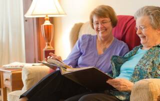 Women looking through photo album